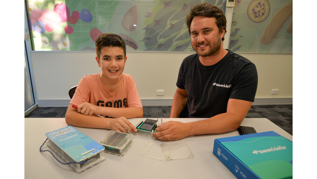 Beenleigh teenager Giovanni Cassella, 12, and PowerWells co-founder Brad Clair tinker with some power banks ahead of upcoming Logan Libraries school holiday workshops.