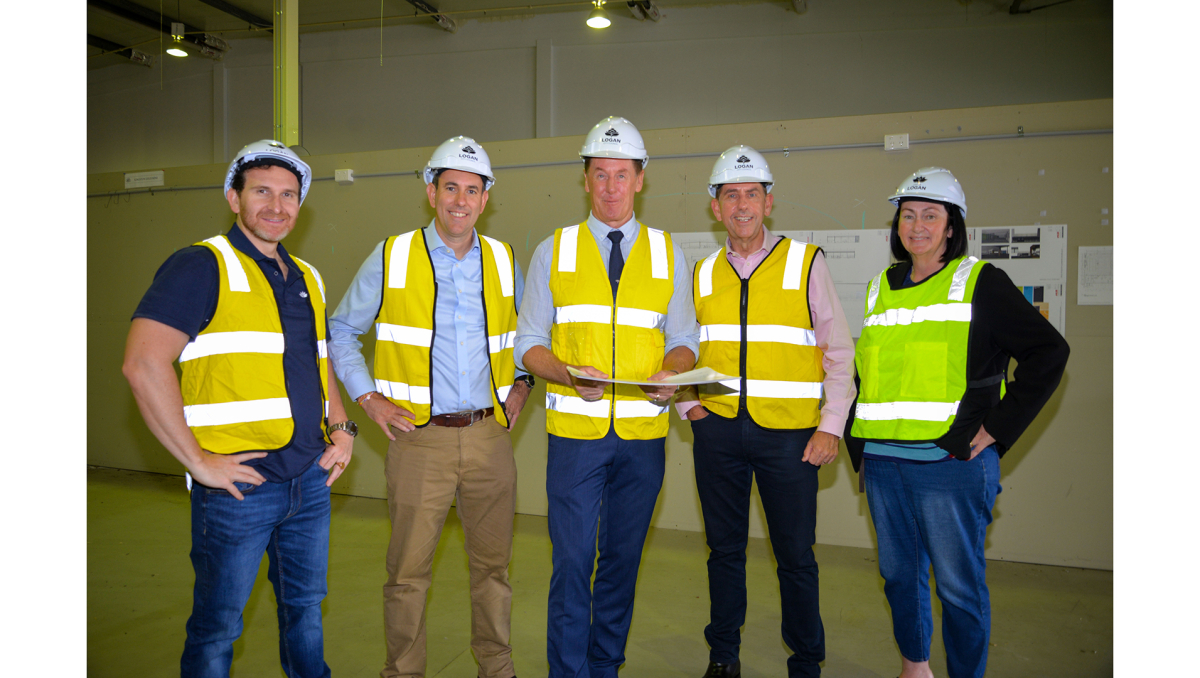 Mayor Darren Power inspects the plans for the Wilbur St Youth Centre with (from left) Lifestyle Chair Cr Tony Hall, Federal Treasurer and Member for Rankin Jim Chalmers, State Treasurer and Member for Woodridge Cameron Dick and Division 2 Councillor Teresa Lane.