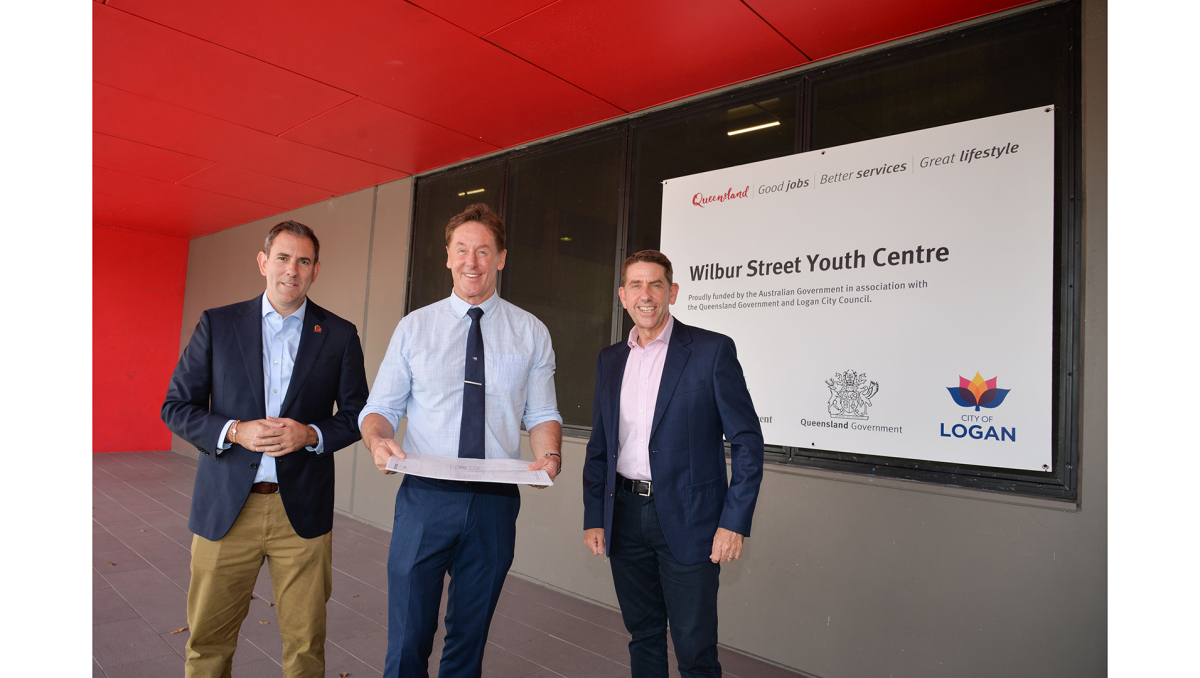 Mayor Darren Power outside the soon-to-be constructed Wilbur St Youth Centre with (from left) Federal Treasurer and Member for Rankin Jim Chalmers and State Treasurer and Member for Woodridge Cameron Dick.