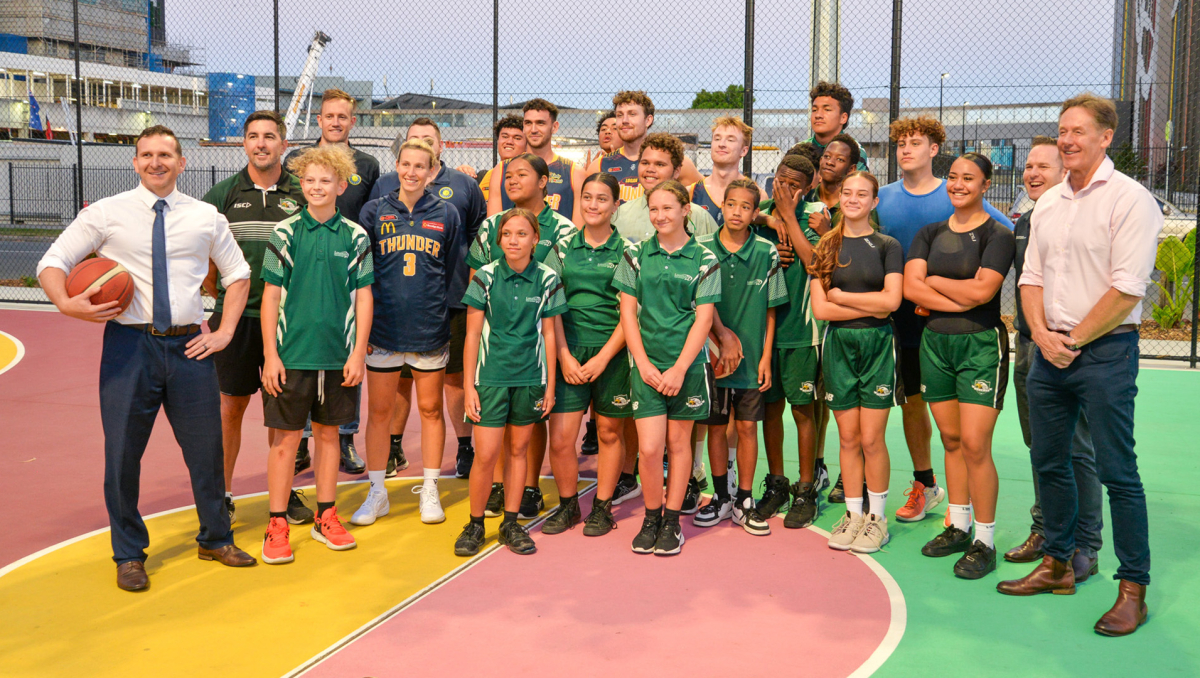Mayor Darren Power and Cr Jon Raven (right) and Cr Tony Hall with basketballers from Logan Thunder, and Loganlea State High School at the Armstrong Place opening.