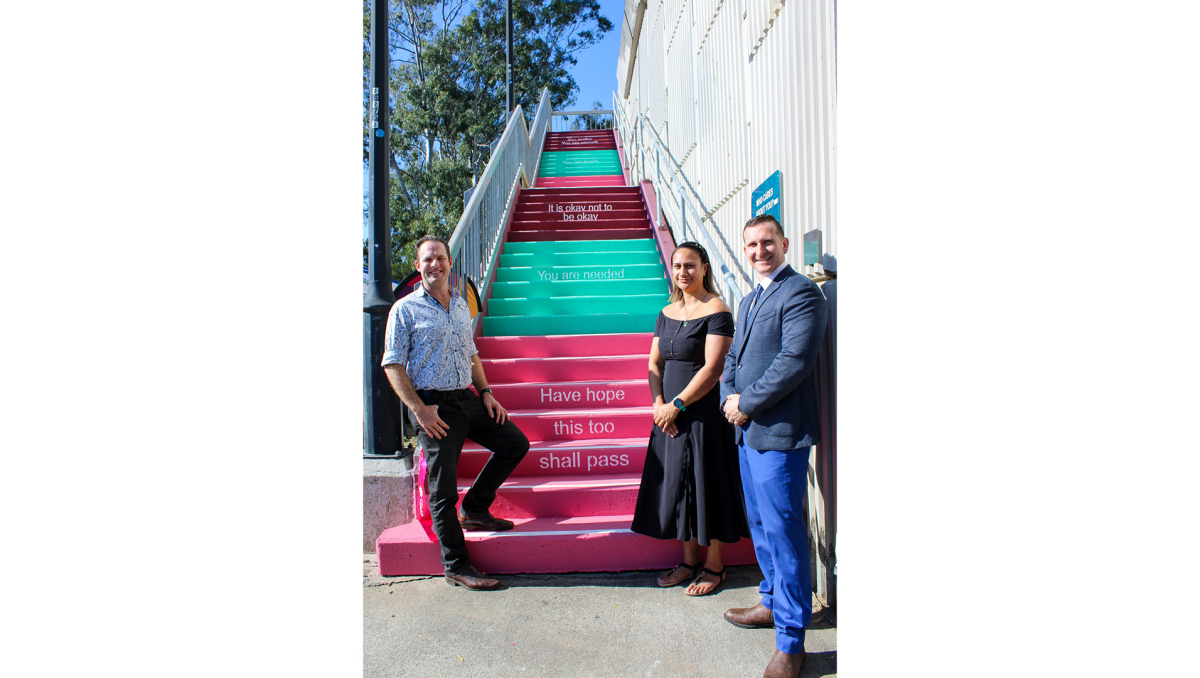 Cr Jon Raven and Cr Tony Hall (right) open the new ‘Hope Stairs’ in Meadowbrook with The Solitude Project founder Destani Davies.