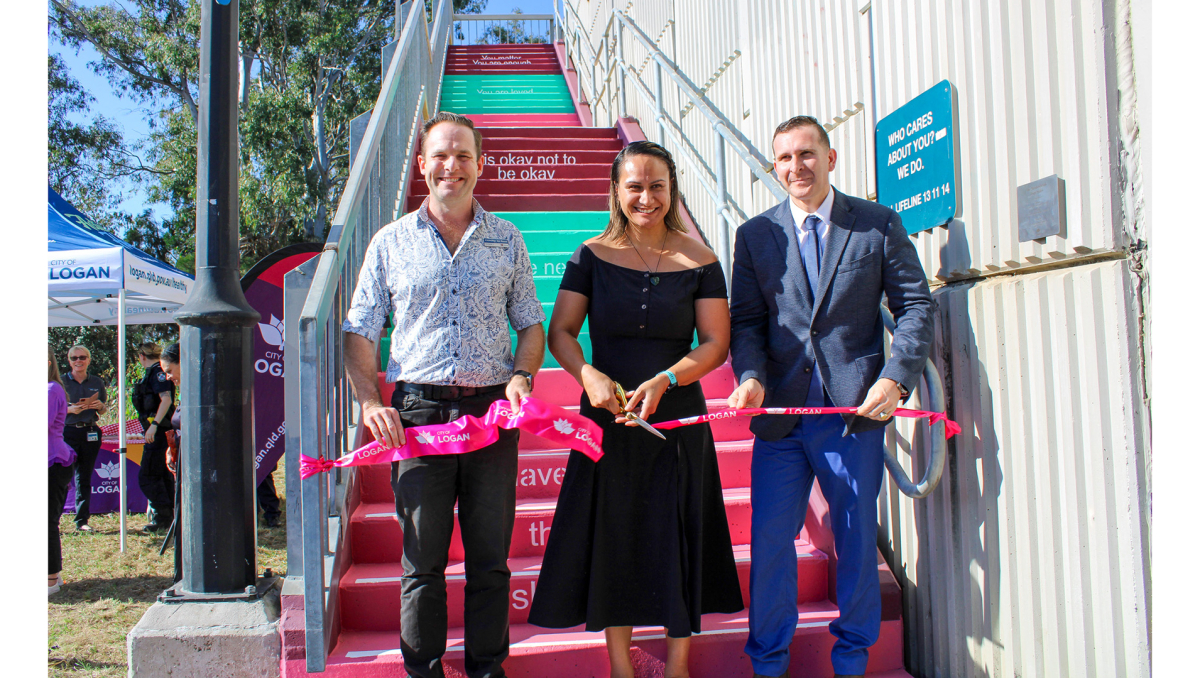 Cr Jon Raven and Cr Tony Hall (right) open the new ‘Hope Stairs’ in Meadowbrook with The Solitude Project founder Destani Davies.