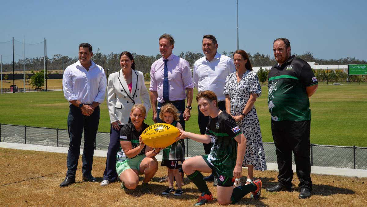 Mayor Darren Power with (from left) Mirvac General Manager Residential Queensland Warwick Bible, Division 11 Councillor Natalie Willcocks, Mirvac Residential Queensland Project Director Mark Clancy, Head of AFL Queensland Trisha Squires, Park Ridge Pirates Junior club members Chris Luxford, (front) Dana Bell, Hendrix Batty and Archer McLuckie.