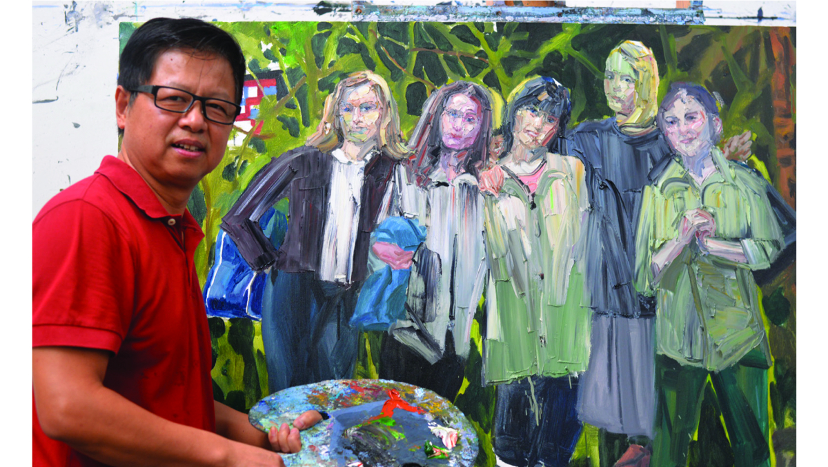 Artist Jun Chen at work in his Woodridge studio.