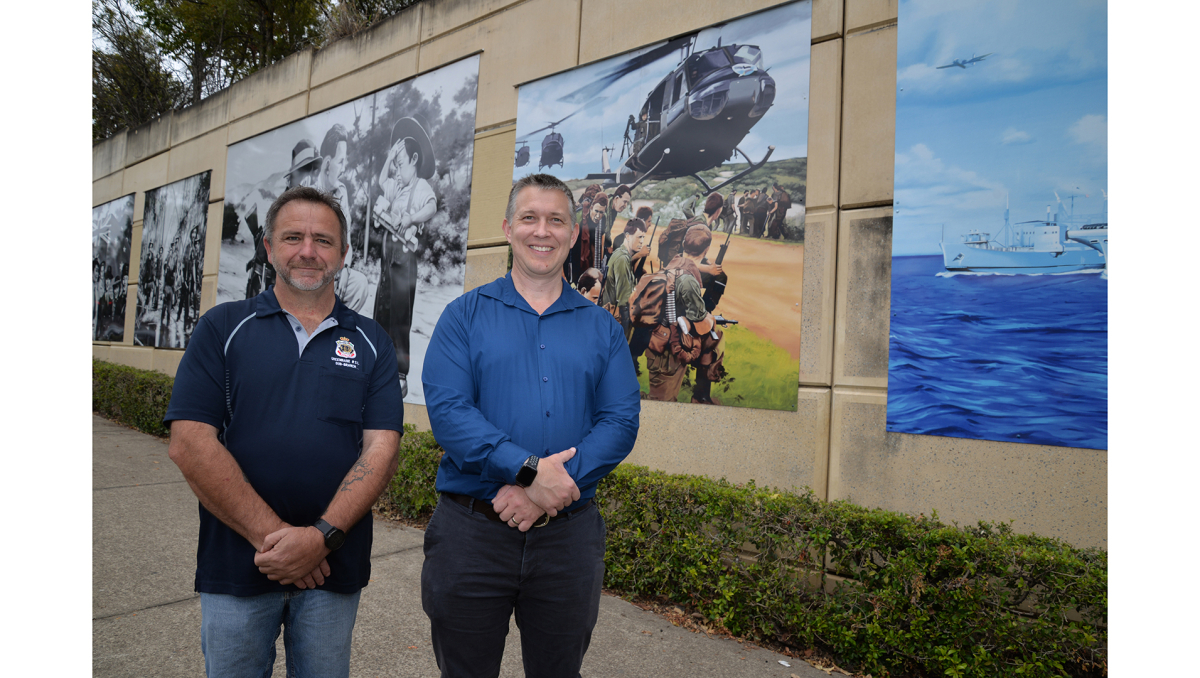 Division 7 Councillor Tim Frazer (right) and Greenbank RSL Sub Branch President Stewart Rae inspect the rejuvenated memorial murals in Hillcrest.
