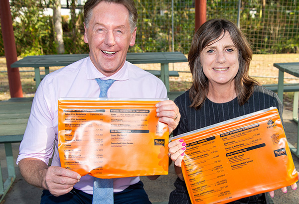 Mayor Darren Power and Cr Lisa Bradley inspect emergency preparedness packs ahead of the next Logan Big Safe Day out at Underwood Park on Saturday, November 18, from 10am – 2pm.