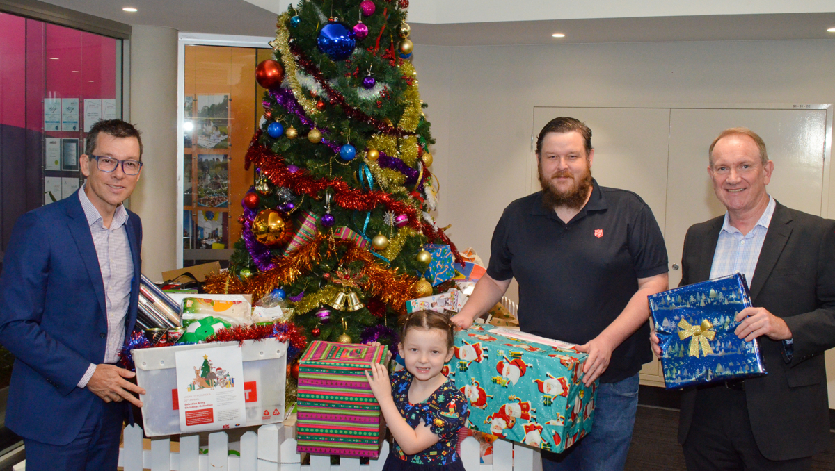 Logan City Council CEO Darren Scott (left) and Director of Organisational Services Robert Strachan (far right) with Logan Salvation Army Captain Anthony Hunt and his daughter Esther.
