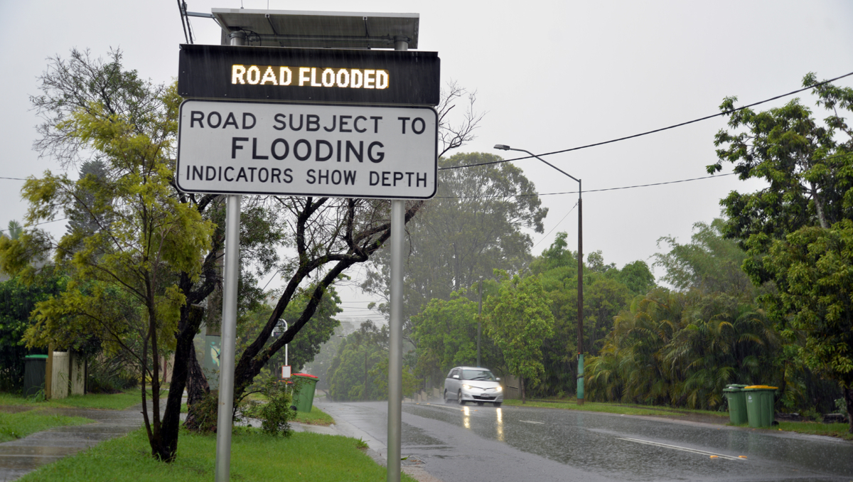 An image of a Road Flood sign at Shailer Park to illustrate that more than 100 roads across the City of Logan are impacted by the weather.