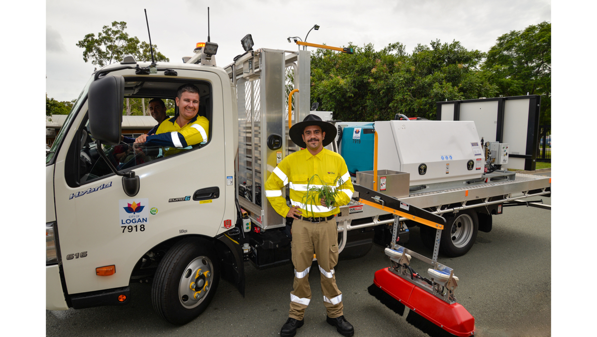 Logan City Council officers Steve Allan (in the driver's seat), Michael Moody (seated) and Zacary Brits with the new weed sensor technology being used by Council.