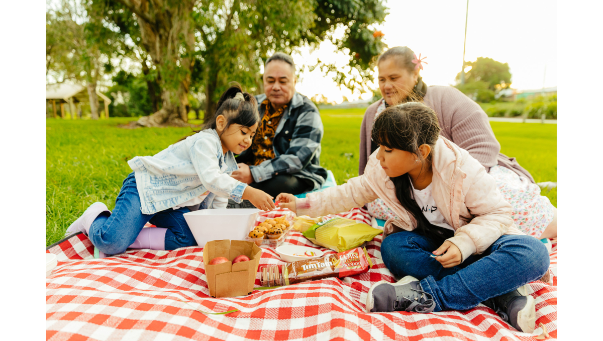 Enjoying a picnic together ahead of Neighbour Day 2024 and encouraging others to do the same are Ocean Howe (left), Pati Mapu (back left), Malili Mapu (back right) and Skye Howe (front right).