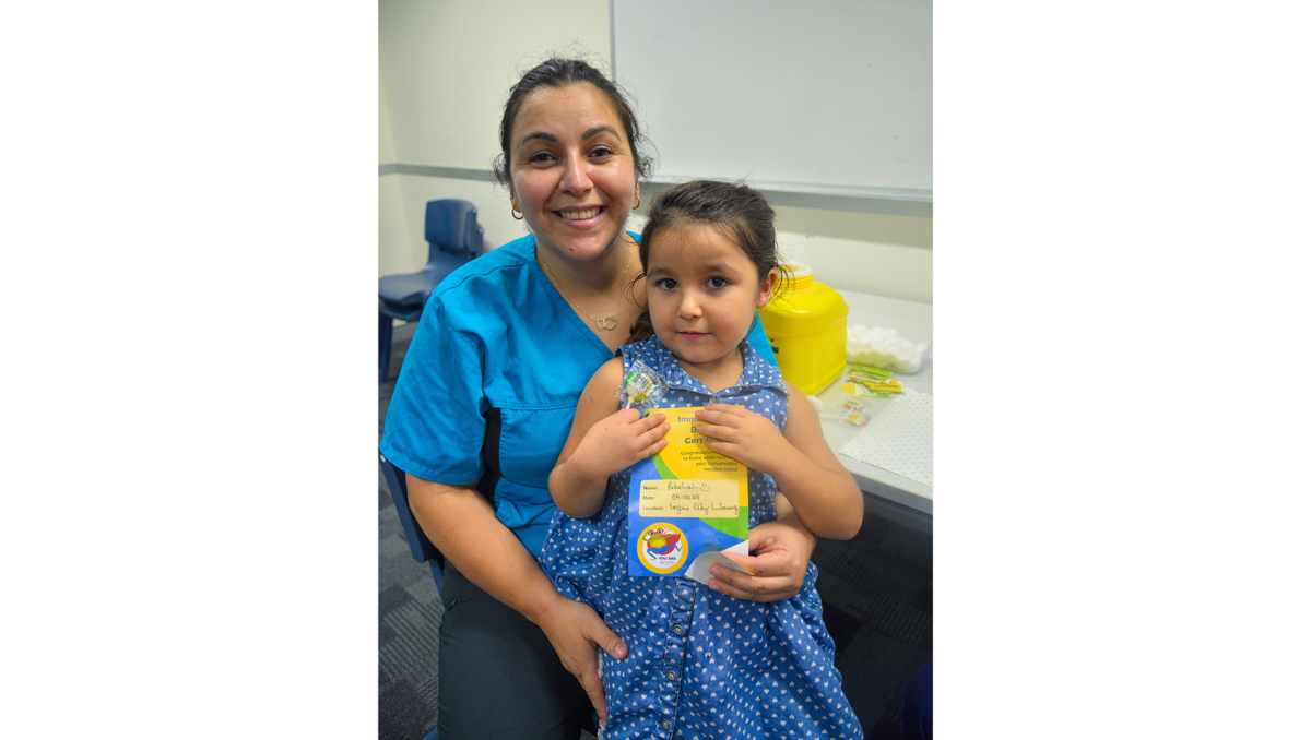 Rebekah Garcia Ascensio, 4, of Woodridge, with mum Andrea and her vaccination bravery certificate.