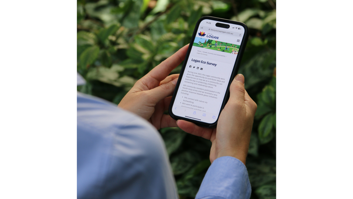 This is a photo of someone viewing this year's Logan Eco Survey on their mobile phone.
