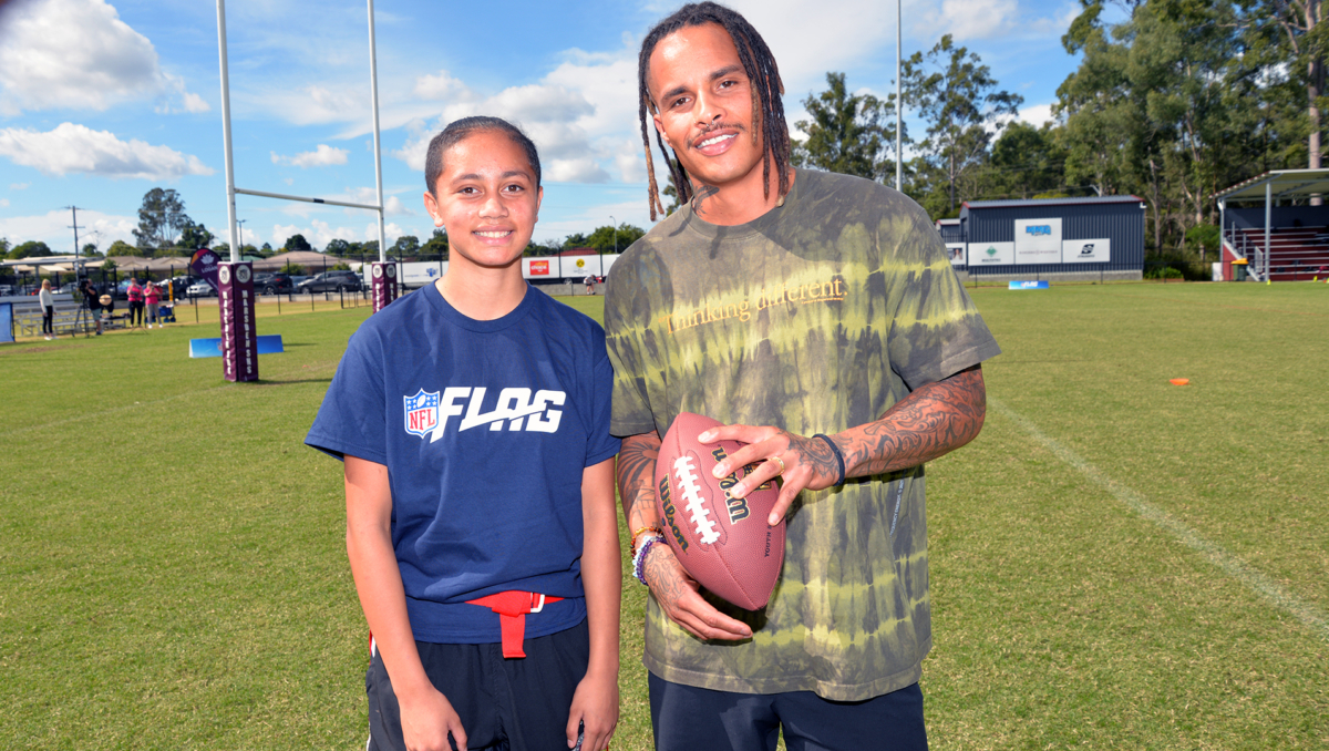 An image of Marsden's Shyloh Cofae, 14, with retired NFL wide receiver Kenny Stills at the NFL Flag day.