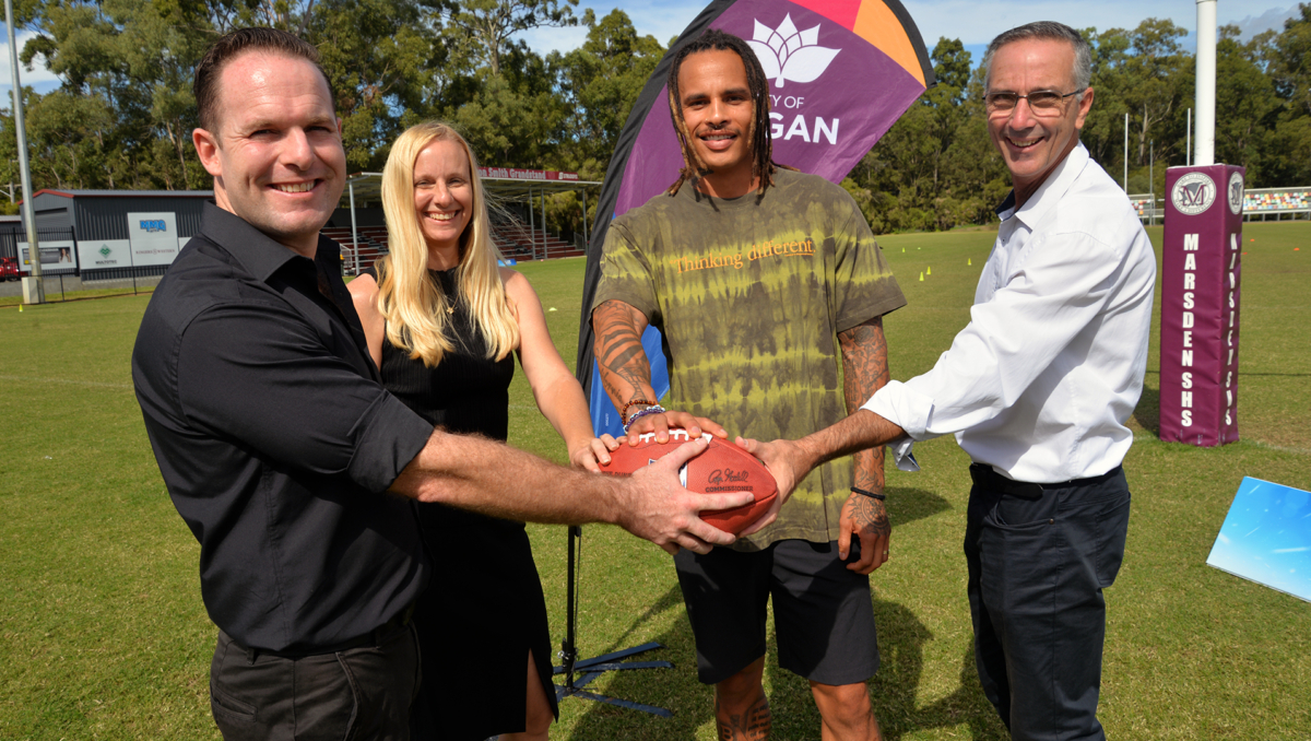 An image of Retired NFL footballer Kenny Stills with (from left) Logan Mayor Jon Raven, Economic Development Chair Cr Miriam Stemp and Division 5 Cr Paul Jackson at the NFL Flag trial day at Marsden State High School.