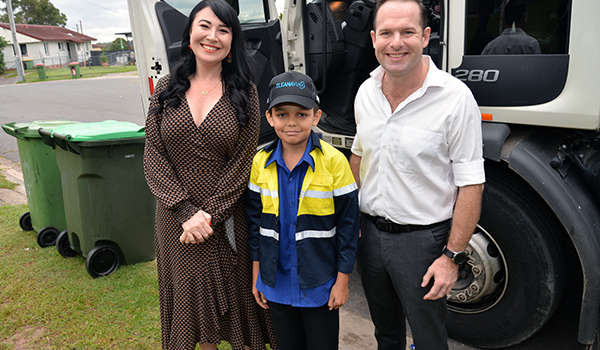 An image of City of Logan Mayor Jon Raven and Division 3 Councillor Mindy Russell with garbage truck fan Ethan Nilsen, 11, of Daisy Hill.