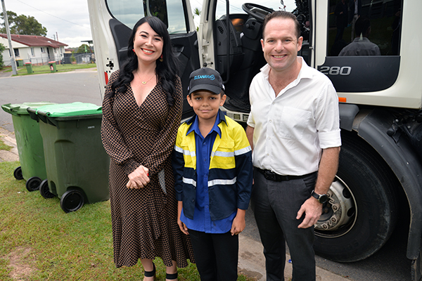 An image of City of Logan Mayor Jon Raven and Division 3 Councillor Mindy Russell with garbage truck fan Ethan Nilsen, 11, of Daisy Hill.