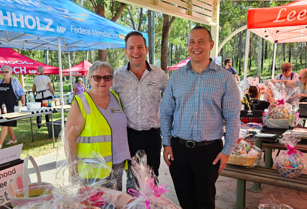 An image of Mayor Jon Raven (centre) and Cr Tim Frazer with Forestdale NHW’s Lynn Whittingham at the group’s 35th Big Birthday Bash.