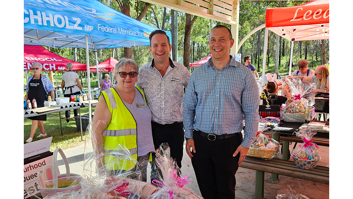 An image of Mayor Jon Raven (centre) and Cr Tim Frazer with Forestdale NHW’s Lynn Whittingham at the group’s 35th Big Birthday Bash.