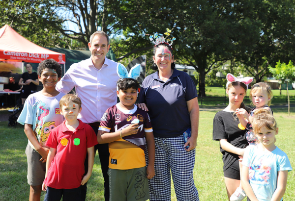 An image of Cr Teresa Lane, and Federal Treasurer and the Member for Rankin Jim Chalmers catching up with some kids enjoying the Easter Fun day in Ewing Park.