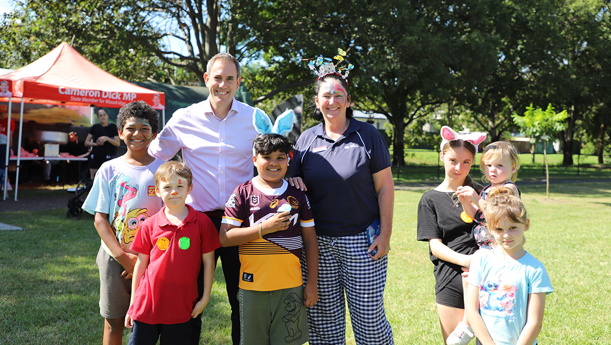 An image of Cr Teresa Lane, and Federal Treasurer and the Member for Rankin Jim Chalmers catching up with some kids enjoying the Easter Fun day in Ewing Park.