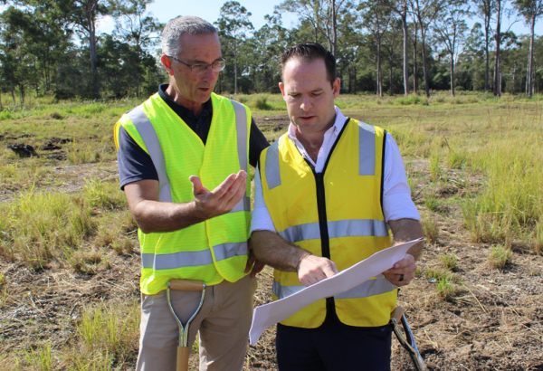 An image of Mayor Jon Raven and Cr Paul Jackson reviewing plans for the new Waterford West District Park.