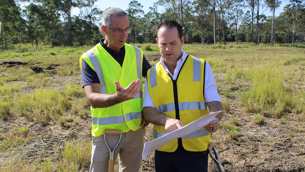 An image of Mayor Jon Raven and Cr Paul Jackson reviewing plans for the new Waterford West District Park.