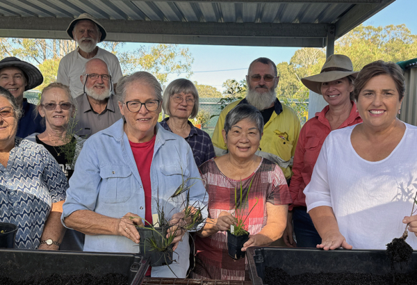 An image of Cr Karen Murphy (right) with members of the Logan River Branch of NPQ at their new undercover work area at Olivers Sports Complex in Eagleby.