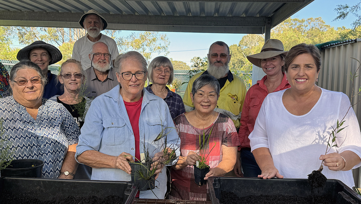 An image of Cr Karen Murphy (right) with members of the Logan River Branch of NPQ at their new undercover work area at Olivers Sports Complex in Eagleby.