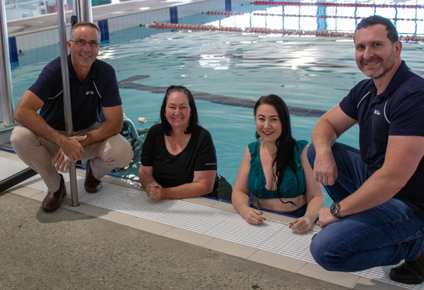 An image of Councillors Paul Jackson, Teresa Lane, Mindy Russell and Tony Hall who all kicked in to purchase a new poolside hydraulic lift at Gould Adams Aquatic Centre in Kingston.