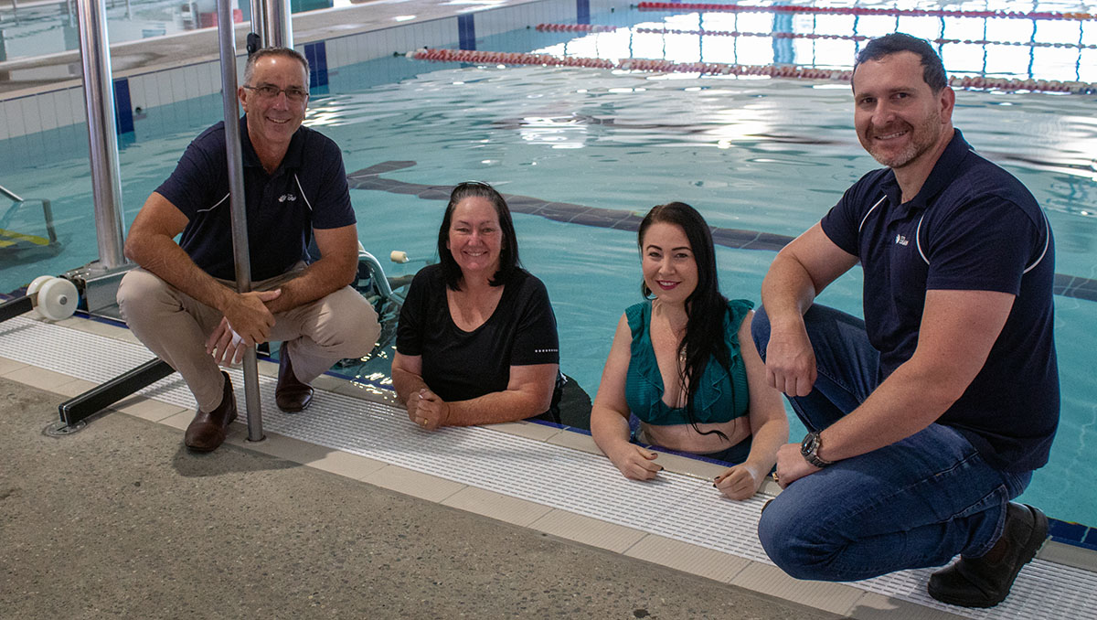 An image of Councillors Paul Jackson, Teresa Lane, Mindy Russell and Tony Hall who all kicked in to purchase a new poolside hydraulic lift at Gould Adams Aquatic Centre in Kingston.