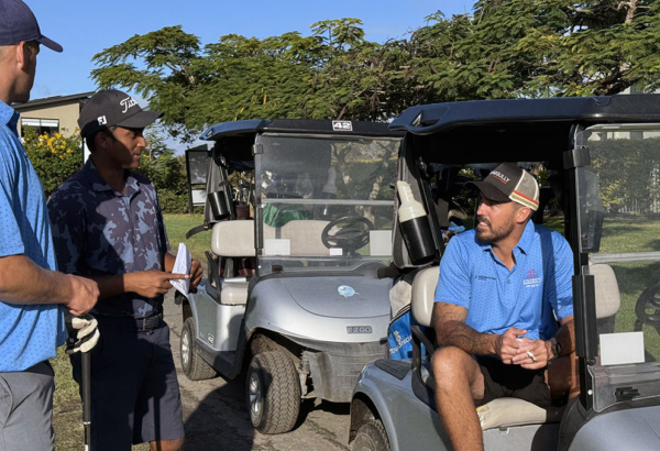An image of Cr Nathan St Ledger (right) getting ready to tee-off in the pro-am prior to the Queensland PGA Associate Championship at Windaroo Lakes Golf Club.