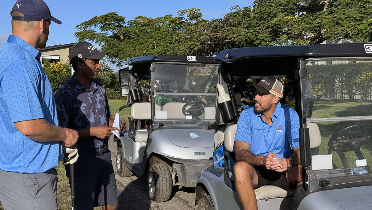 An image of Cr Nathan St Ledger (right) getting ready to tee-off in the pro-am prior to the Queensland PGA Associate Championship at Windaroo Lakes Golf Club.