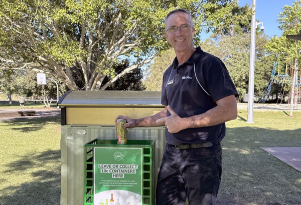 An image of Cr Paul Jackson using one of the Containers for Change baskets in Tygum Park in Waterford West.