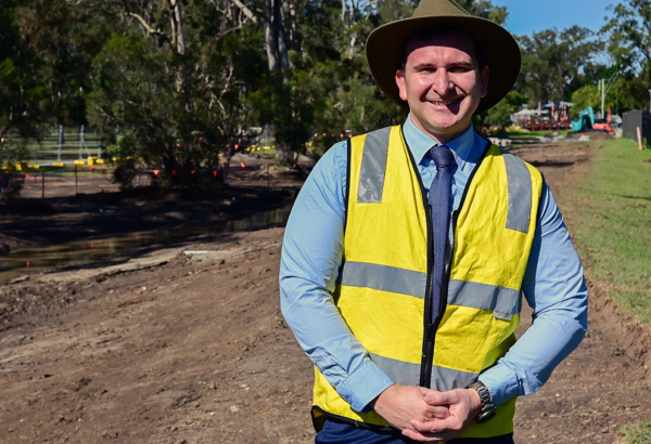 aN IMAGE OF Cr Tony Hall inspectING the start of works on the Sturdee Park drain naturalisation project in Loganlea.