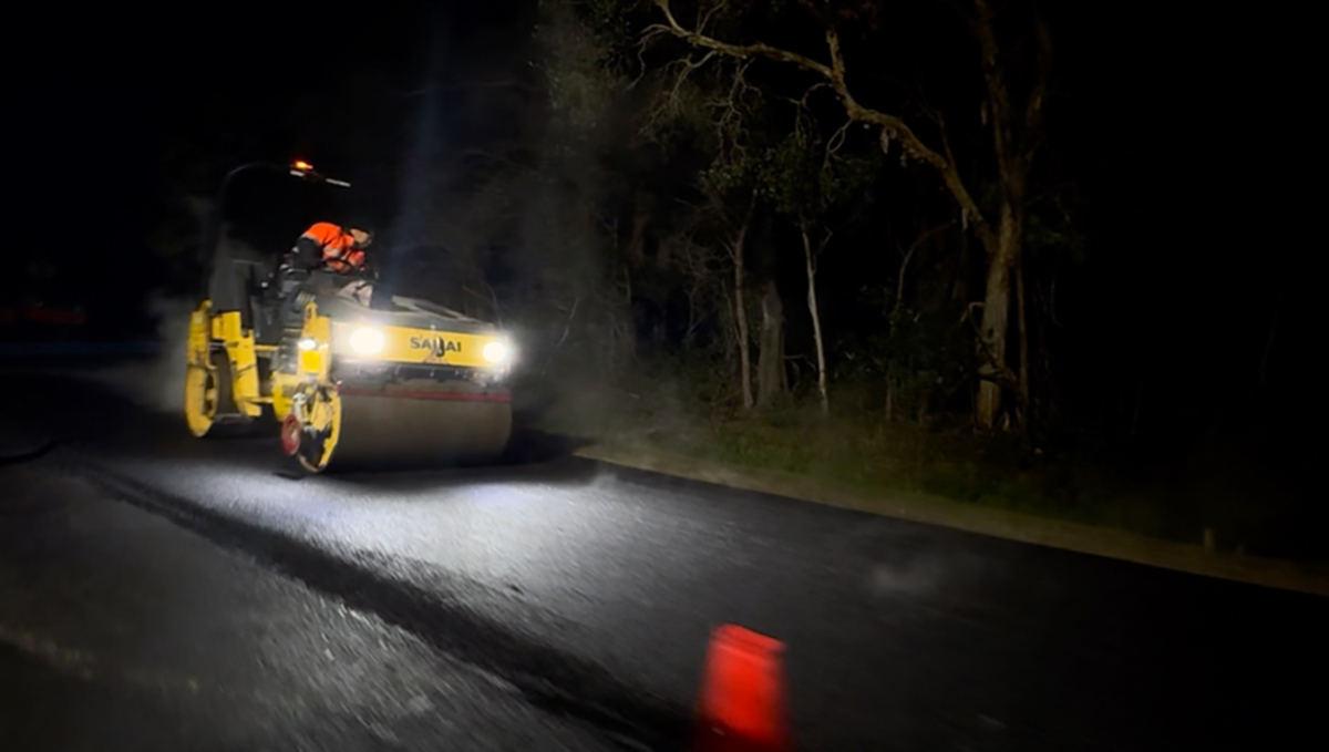 An image of road patching underway at night on School Road at Logan Reserve