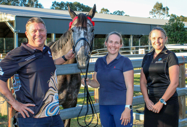 An image of Cr Scott Bannan (left) with Scenic Rim Equestrian Club committee members Clare Flynn and Michelle Merrigan and 5-year-old thoroughbred, Storm.