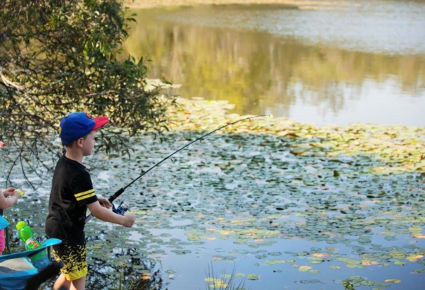 Children fishing in a river