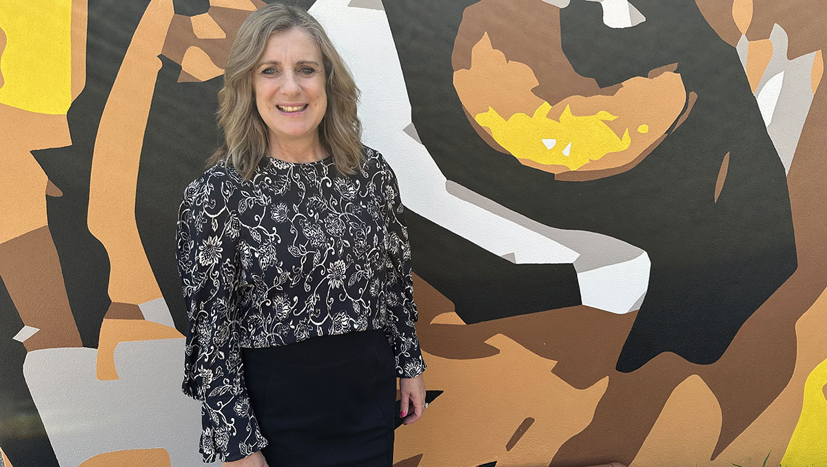 Cr Lisa Bradley at the striking new mural at Rochedale Tigers Rugby League Football Club at Underwood Park. An image of Cr Lisa Bradley at the striking new mural at Rochedale Tigers Rugby League Football Club at Underwood Park.