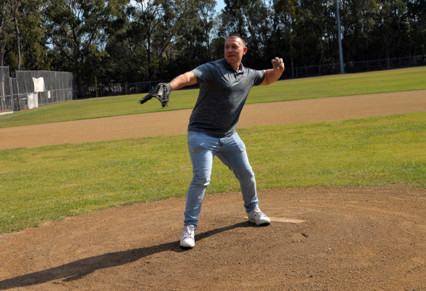 Cr Tim Frazer throws a ceremonial opening pitch at Southern Stars Baseball Club. An image of Cr Tim Frazer throwing a ceremonial opening pitch at Southern Stars Baseball Club.