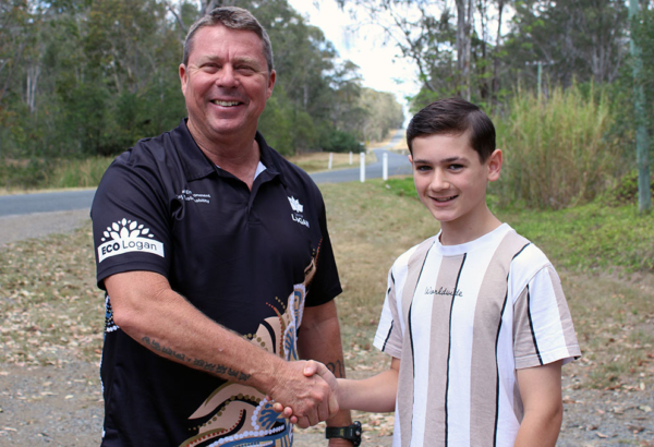 Division 9 Councillor Scott Bannan with Woodhill State School student Sonny Barker, 12, on Irwin Road in Cedar Grove. An image of Division 9 Councillor Scott Bannan with Woodhill State School student Sonny Barker, 12, on Irwin Road in Cedar Grove.