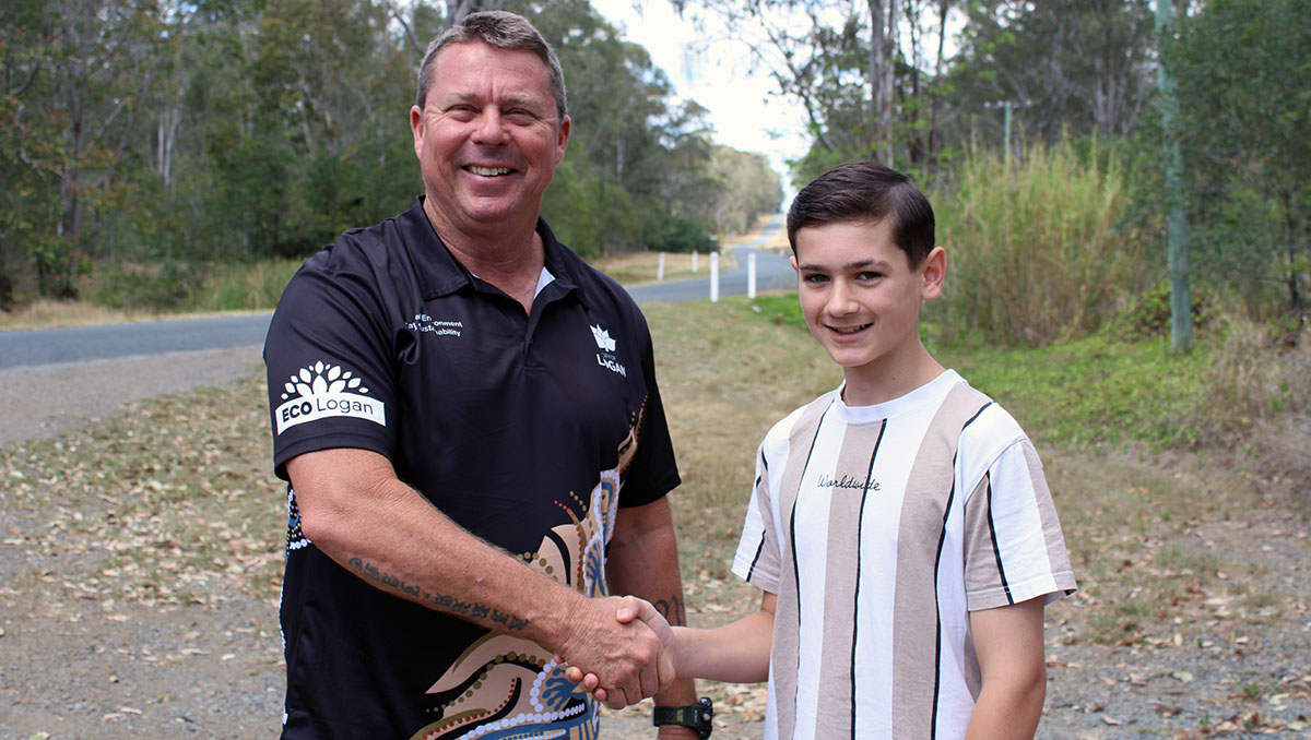 Division 9 Councillor Scott Bannan with Woodhill State School student Sonny Barker, 12, on Irwin Road in Cedar Grove. An image of Division 9 Councillor Scott Bannan with Woodhill State School student Sonny Barker, 12, on Irwin Road in Cedar Grove.