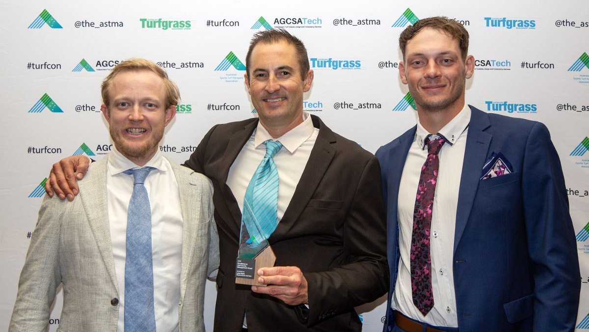 Luke Helm (centre) with Meadowbrook GC general manager Steven Linskey (left) and apprentice Ethan Gale (right)